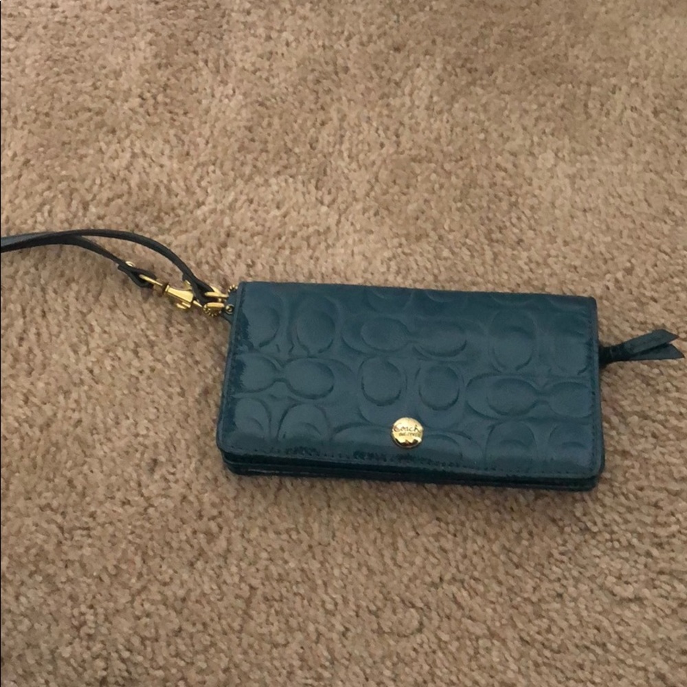 Used dark teal Coach wristlet